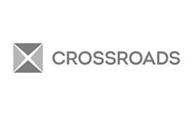 A gray geometric X symbol sits to the left of the word CROSSROADS in uppercase gray letters on a white background, reflecting the sleek style often found in custom WordPress website designs.