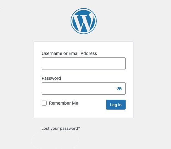 WordPress login screen showing the WordPress logo above fields for Username or Email Address and Password, a Remember Me checkbox, a blue Log In button, and a Lost your password? link below.